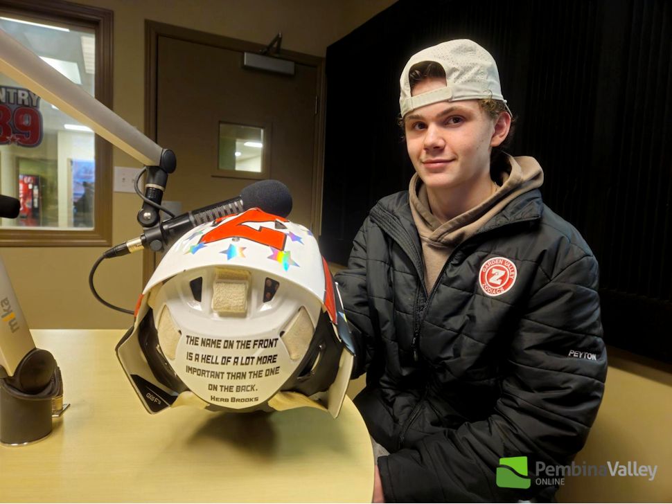 Peyton with his Zodiacs mask, featuring a quote by Herb Brooks